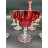 A Collection of 11 Antique cranberry glass and facet cut stem wine glasses, together with