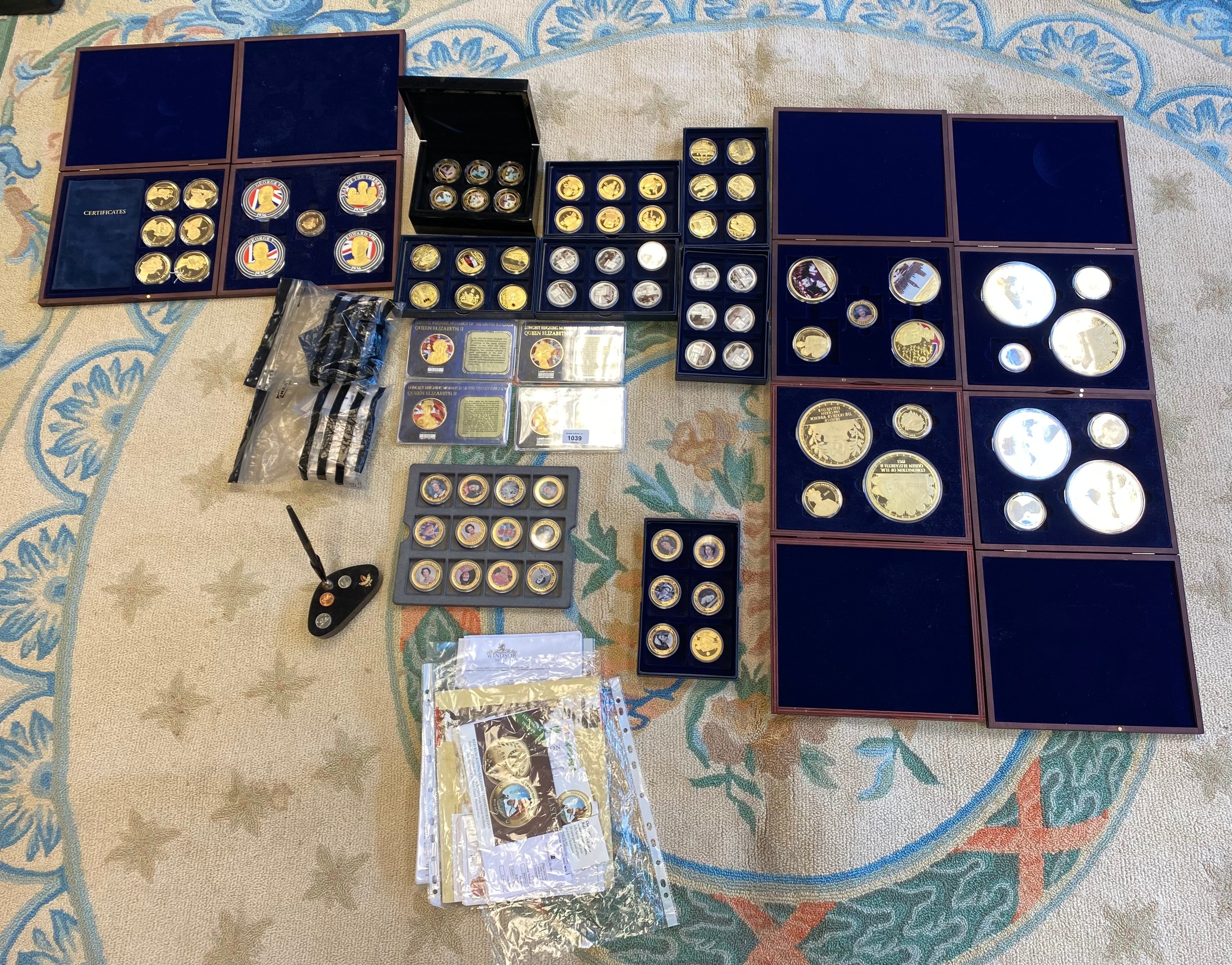 Large collection of gold and silver plated Royalty and Commemorative cased coins, comes with