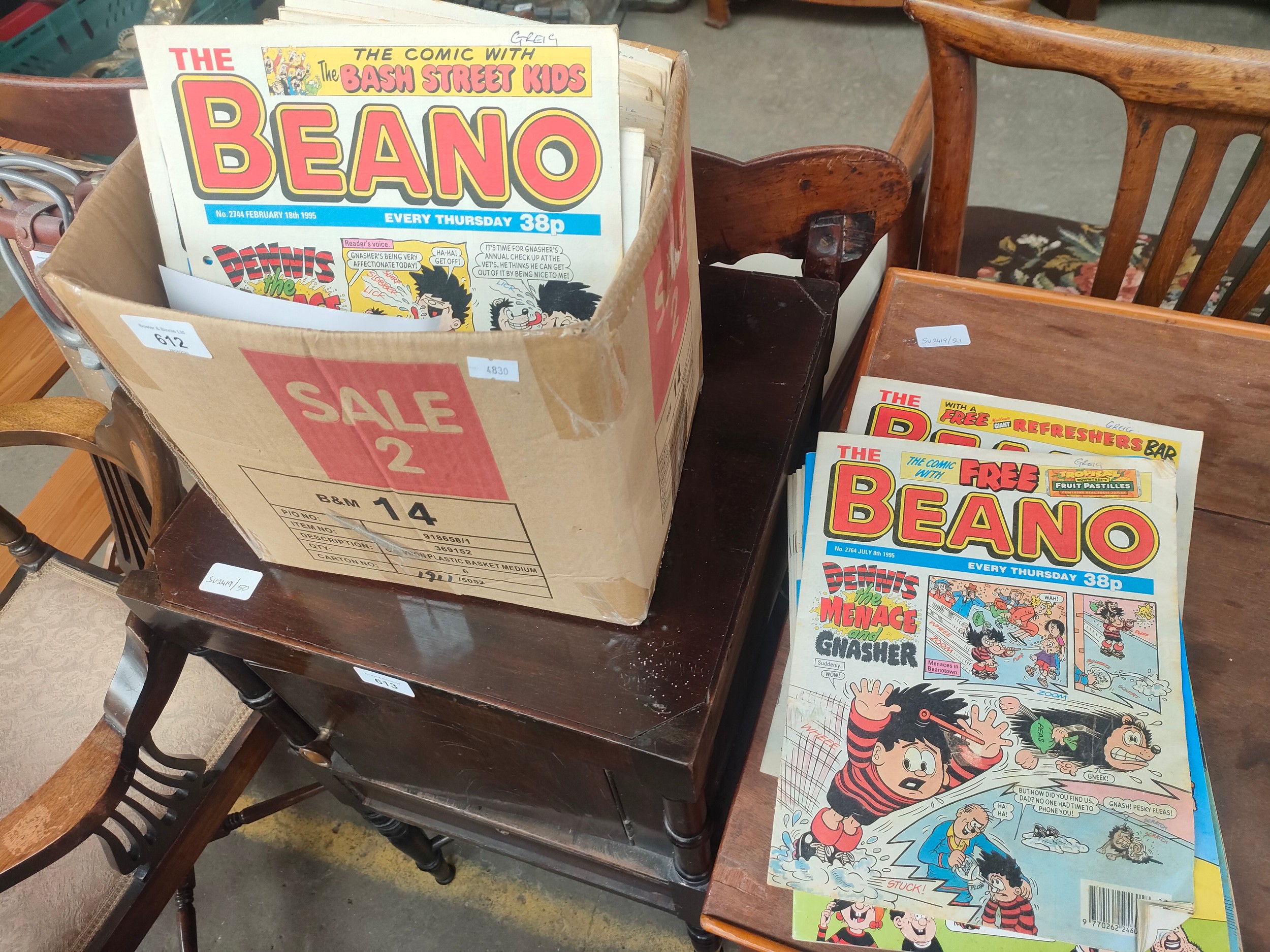 A box of over 80 1990s Beano comics.