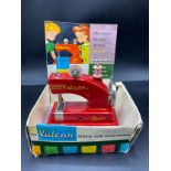 Vintage Vulcan Childs sewing machine with original box.