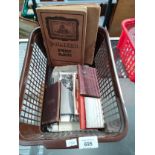 Small crate of stamp albums, books and postcards.