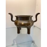 19th century Chinese Bronze two handle censor burning pot. Impressed four character signature to the