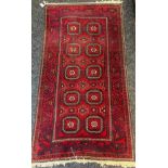 Persian style red ground rug. [195x102cm]