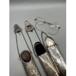 Three Birmingham silver spectacle holders. Together with gilt metal spectacles.