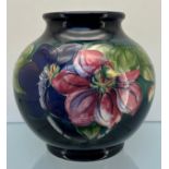 A Large W Moorcroft 'Clematis' pattern bulbous vase. 'Potter to H.M. The Queen' impressed to the