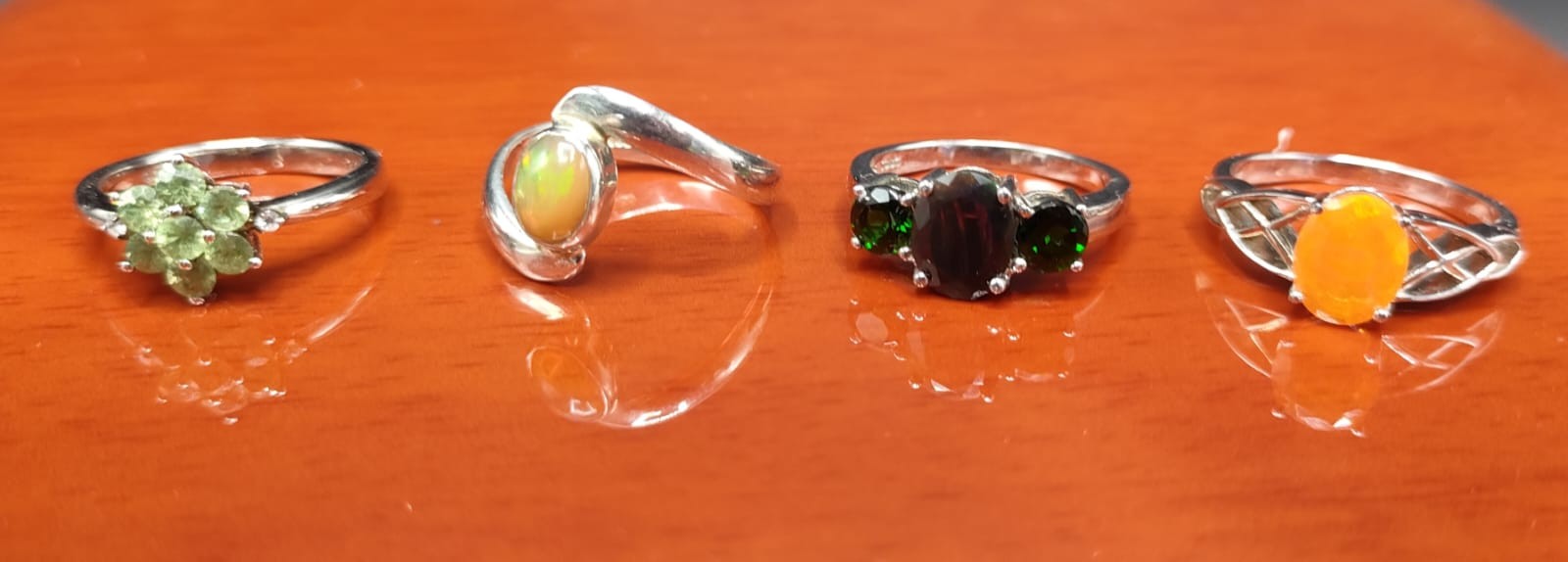 Four 925 silver and gem stone rings includes Ethiopian opal stone set ring.