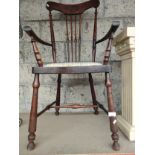 A 19th century arm chair on turned supports