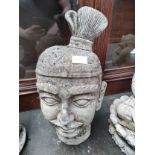 A Tibetan Warrior Head Garden ornament [approximately 18 inches in height]