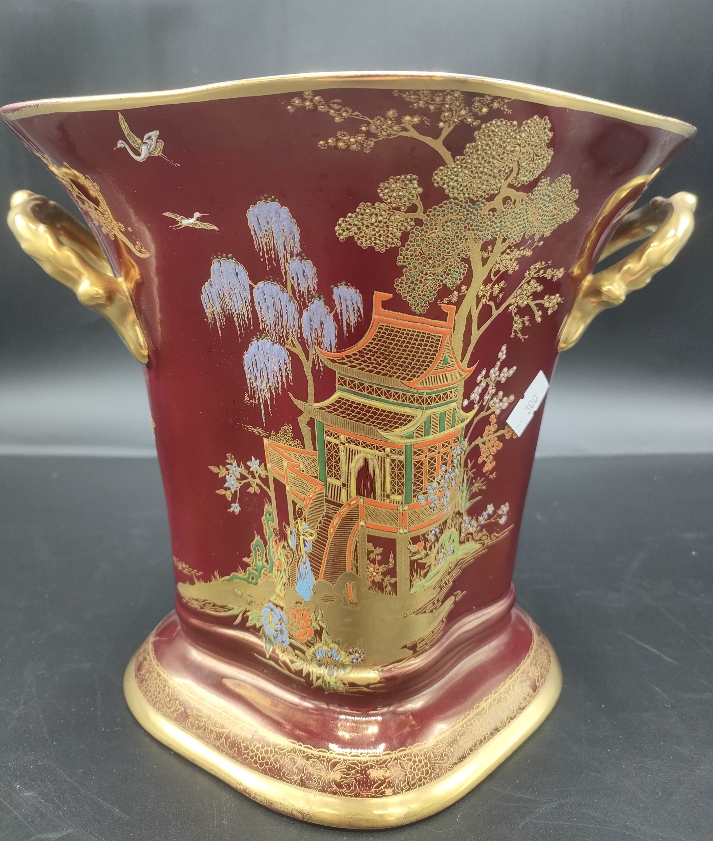 Art deco twin handled Carlton Ware W&R Stoke on Trent vase, red ground with Pagoda pattern 20cm in