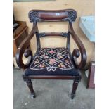 A 19th century scroll back chair on turned supports