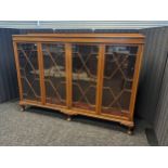 Antique mahogany bookcase, four astragal glazed doors opening to interior storage shelving, raised