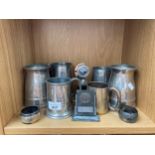 A Shelf of silver plated wares to include tankards