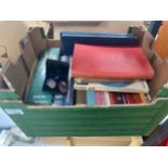 A box of Vintage nursing books along with nursing silver hall marked badge with enamel badge