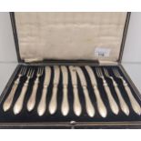 Boxed set of Twelve Birmingham silver handle forks and butter knives.