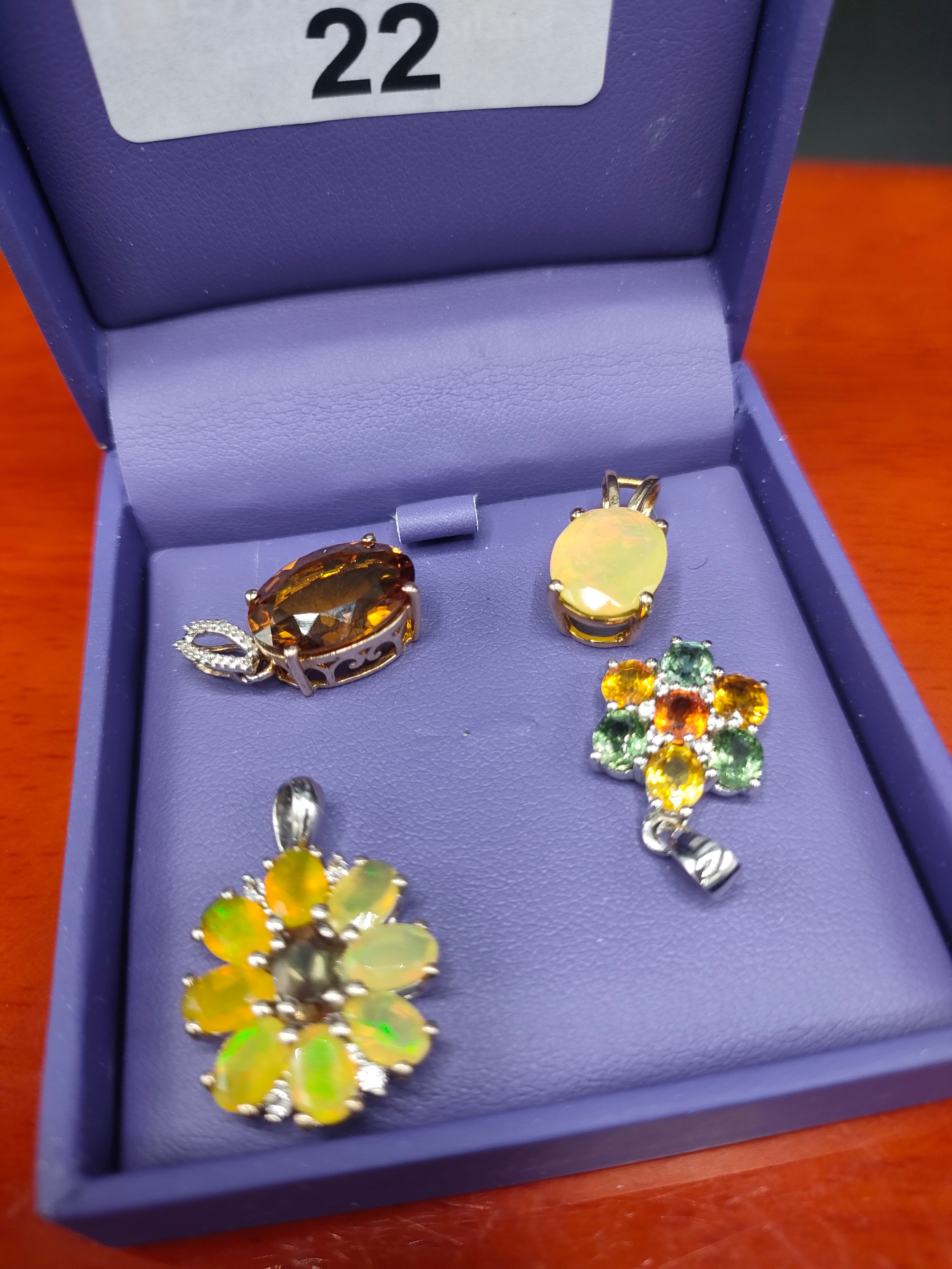 Four various Gold, silver and gem stone pendants. Silver 925 and Ethiopian opal stone set pendant,