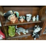 Two shelves of collectables to include Royal Doulton Long John Silver toby jugs, a Harry Potter toby