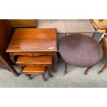 Mahogany carved nest of tables on cabriole legs and a circular side table