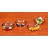 Four 925 silver and gem stone rings includes orange opalescent stone set ring.