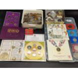 Two large trays of collectable world coins and cased commemorative UK coins set