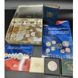 A box of collectable coins and post office savings bank