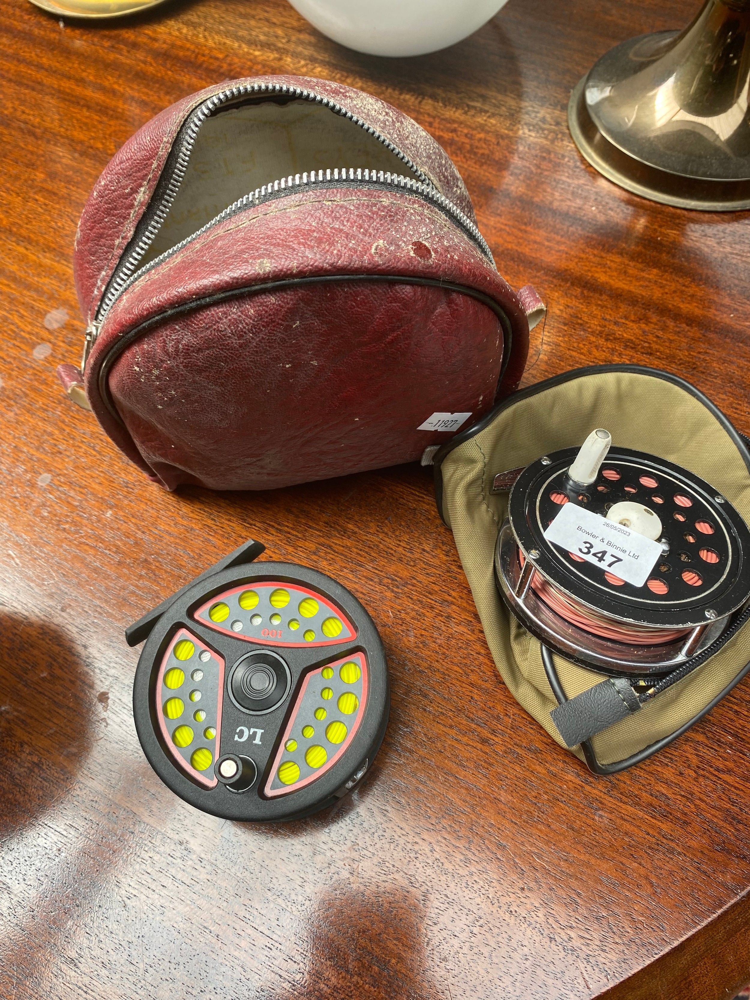 A Leeda fly reel along with Olympia fly reel with two spares spools of line and bag