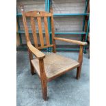 19th Century oak arts and crafts arm chair with basket weaved upholstery