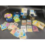 Three boxes of various Pokémon cards