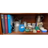 A Shelf of collectables includes pewter tankards, trinket boxes and rolls royce books