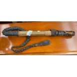 An Antique Indian Whip with hidden blade with a Parquetry design shaft and leather handle