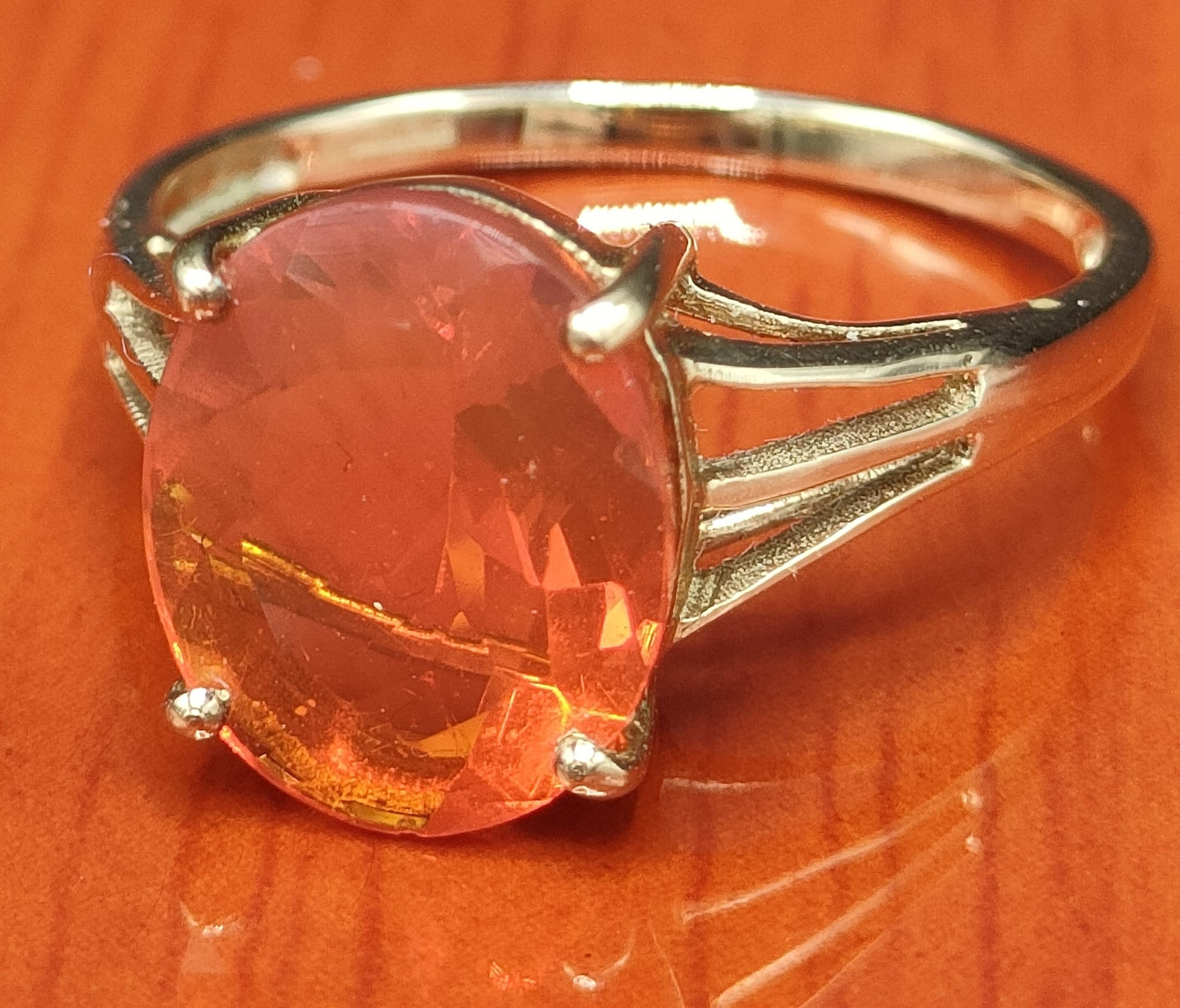 9ct yellow gold ring set with a large fire opal stone. [Ring size N] [2.17Grams]