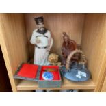 A Shelf of oriental collectables to include figures and a chinese tea pot