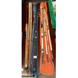A Selection of fishing rods with bags