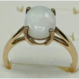 10ct yellow gold ladies ring set with a single white Australian opal stone. [Ring size N] [1.