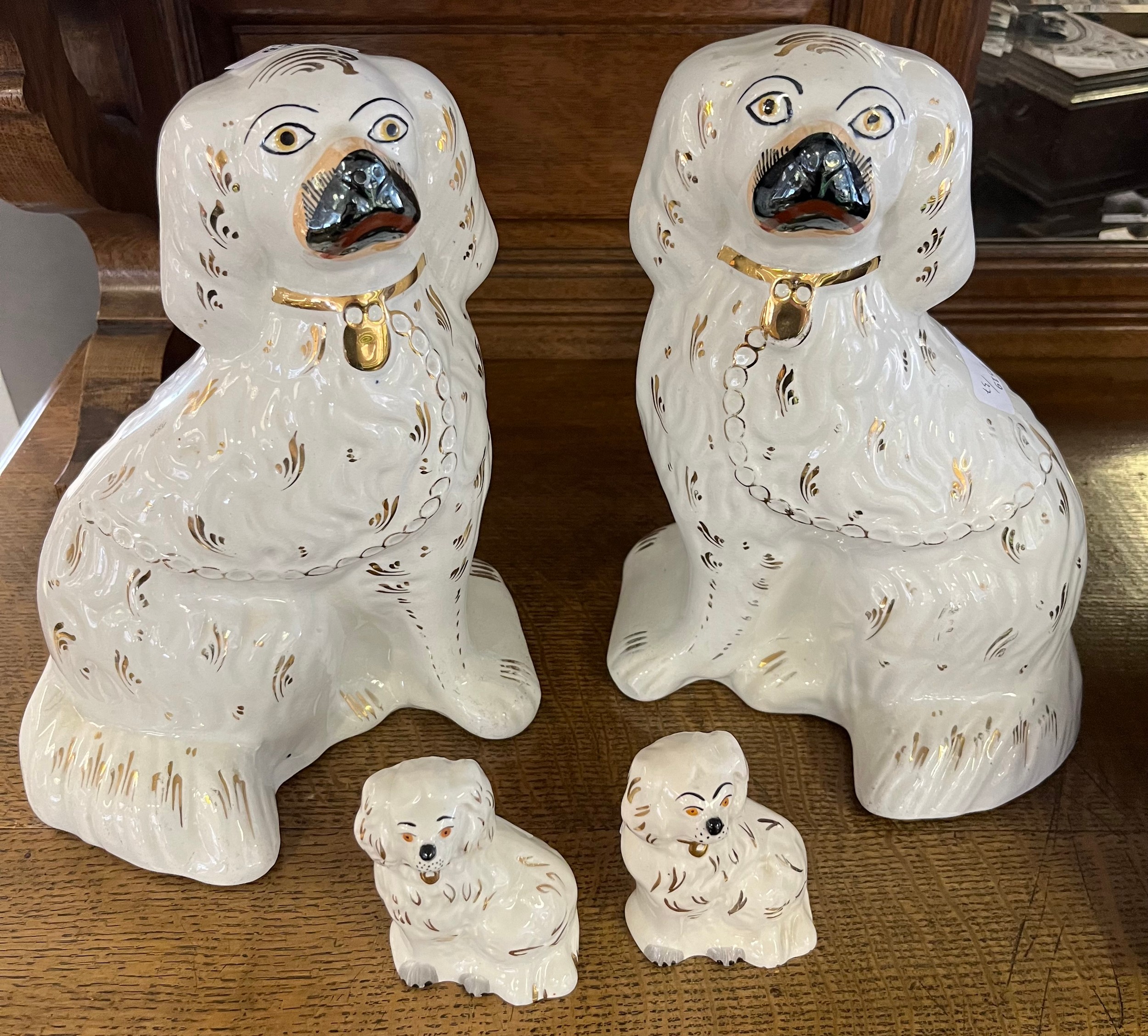 A Pair of Staffordshire wally dogs together with a small pair of Beswick wally dogs