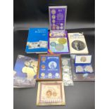 Box of framed British coins and coin books