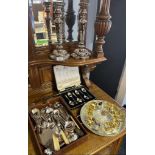 A Selection of silver plated ware to include ornate candle sticks, serving tray, canteen of tea