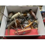 A box of Vintage Corkscrews includes antique wooden handled cork screws