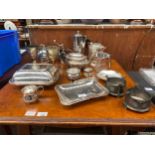 A Large selection of silver plated wares to include tea pots and swing handled basket