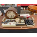 A Tray of collectables includes mantle clock, plated flask, vintage alarm clocks includes smith
