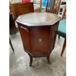 Reproduction small church style cabinet with leather top & fitted lion faced handle