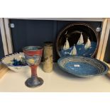A Shelf of studio pottery items to include Iceland Lava vase, Michael Kennedy studio pottery Sligo