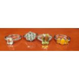 Four 925 Silver and gem stone rings includes three orange opalescent stone set ring.