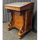 Victorian walnut and mahogany davenport desk, the leather sloped surface lifting up to interior