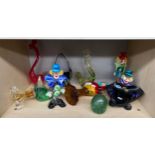 A Large Shelf of art glass to include Murano Glass clowns, art glass bird figures