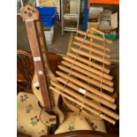 A Eastern themed 3 stringed musical instrument along with an xylophone