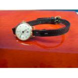 9ct yellow gold cased ladies Certina watch in a working condition. Fitted with a leather strap.