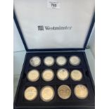 A coin box containing 26 silver proof coins; Britannia 2000 & 2011 one ounce fine silver coins,