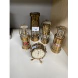 A collection of small miners lamps and small French temperature gauge