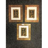 A lot of three African tribal brass figures fitted within frames.