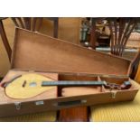 A Eastern 3 string instrument in fitted case